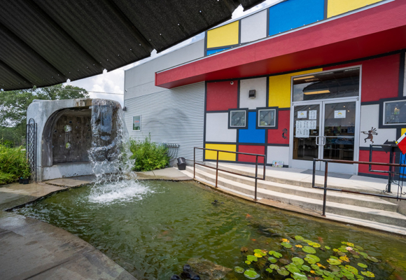 Front of Silo Building San Marcos, Texas. Colorful geometric shapes, waterfall, and pond built by SB Thompson Construction