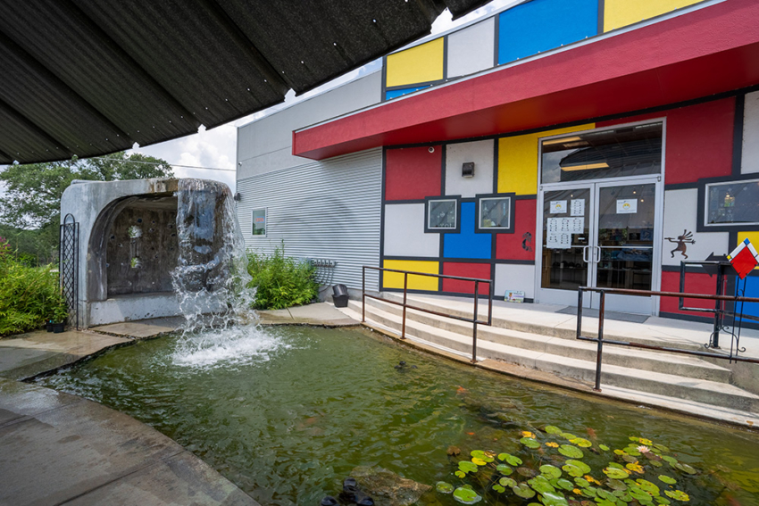 Front of Silo Building San Marcos, Texas. Colorful geometric shapes, waterfall, and pond built by SB Thompson Construction