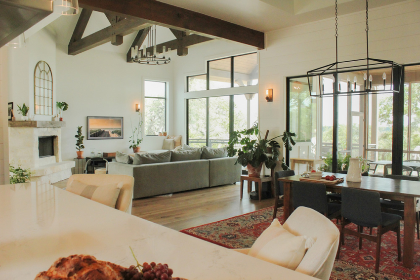 Custom living room with exposed beams and modern farmhouse design with Texas Hill Country Flares built by Home Builder SB Thompson Construction in Wimberley, Texas.