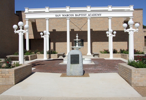 Remembrance gardens built for San Marcos Academy by contractors managed by SB Thomspson construction. Stone and concrete pathways, tall white columns, a decorative white fountain, white lighting and rose garden.
