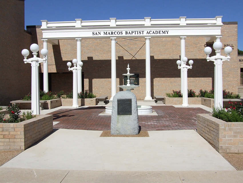 Remembrance gardens built for San Marcos Academy by contractors managed by SB Thomspson construction. Stone and concrete pathways, tall white columns, a decorative white fountain, white lighting and rose garden.